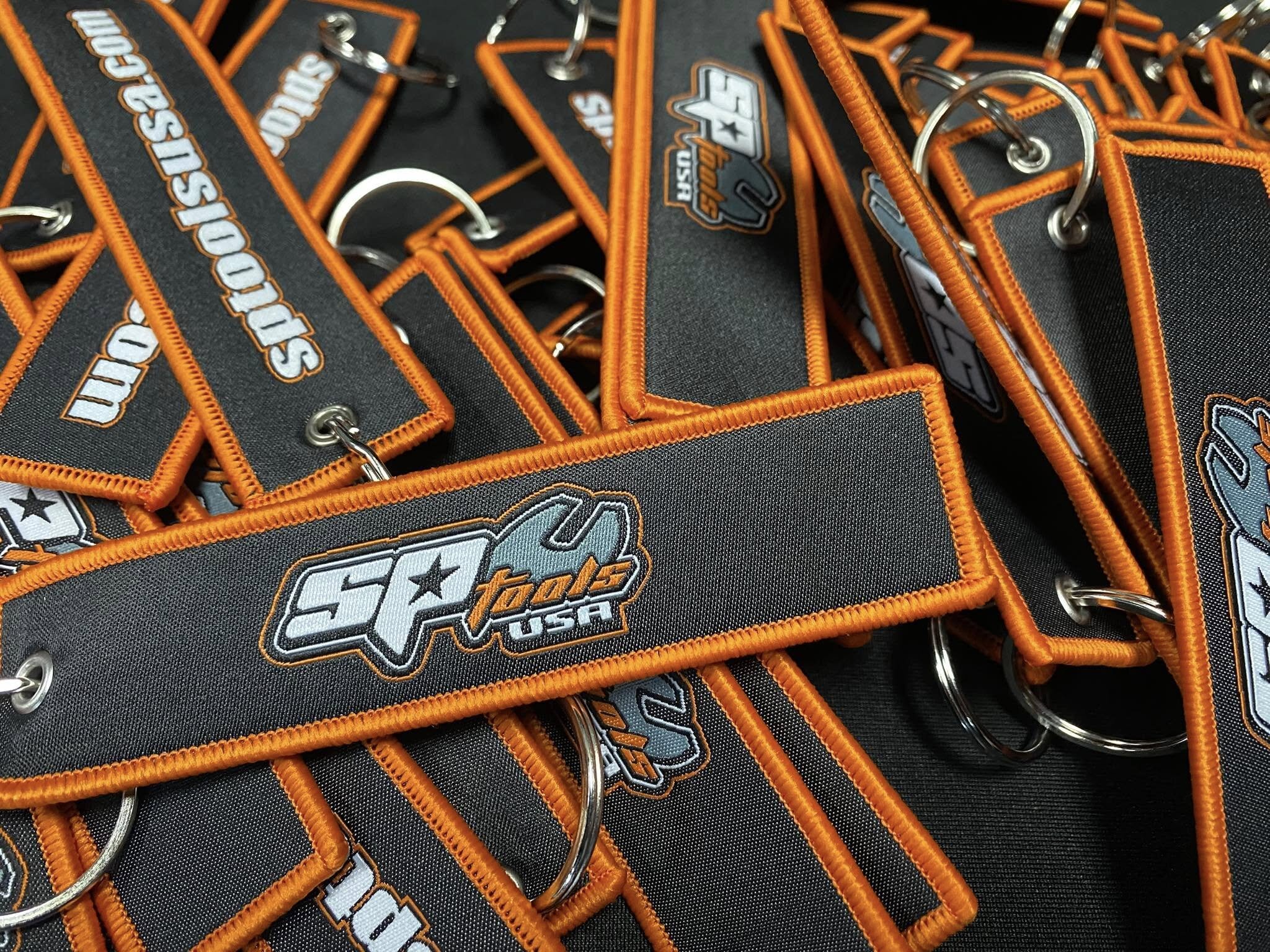 SP Tools USA custom branded key tags with orange border stitching