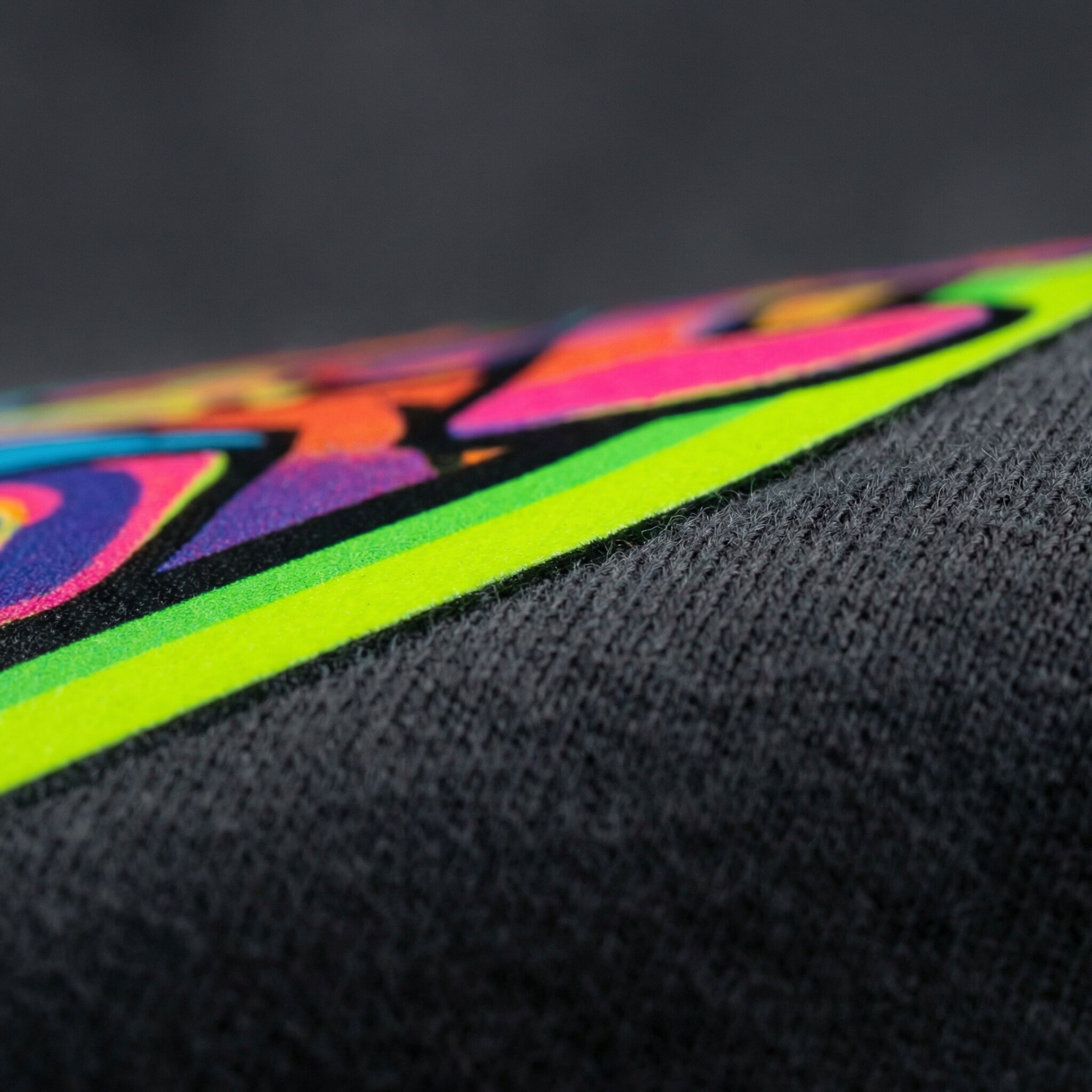 Close-up detail of DTF transfer on apparel showing vibrant colors