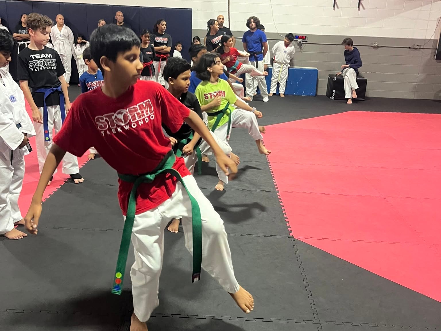 Storm students practicing stances and coordinated movements together