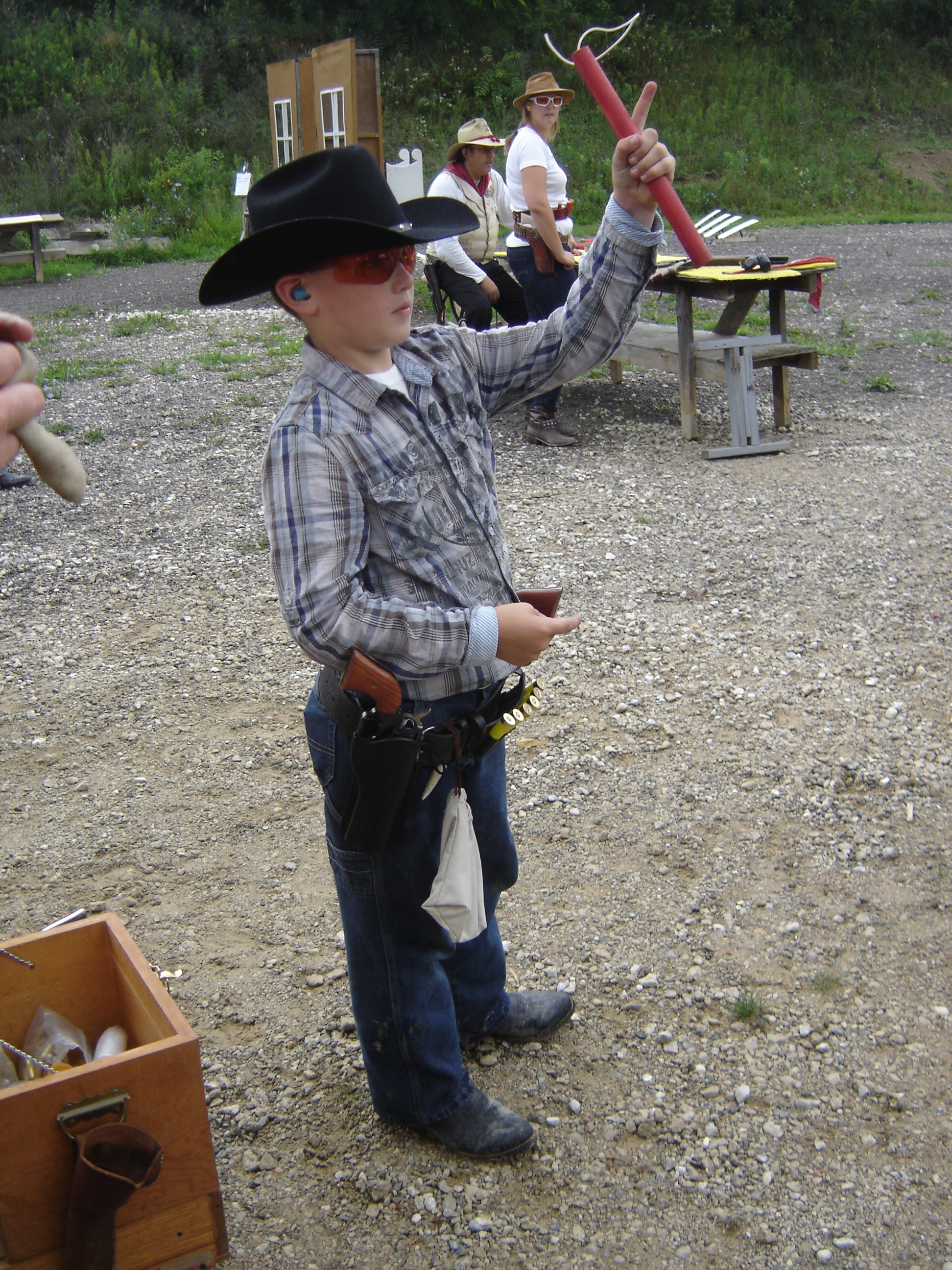 Young cowboy shooter
