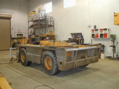 Paint is removed, machine is checked for stress cracks