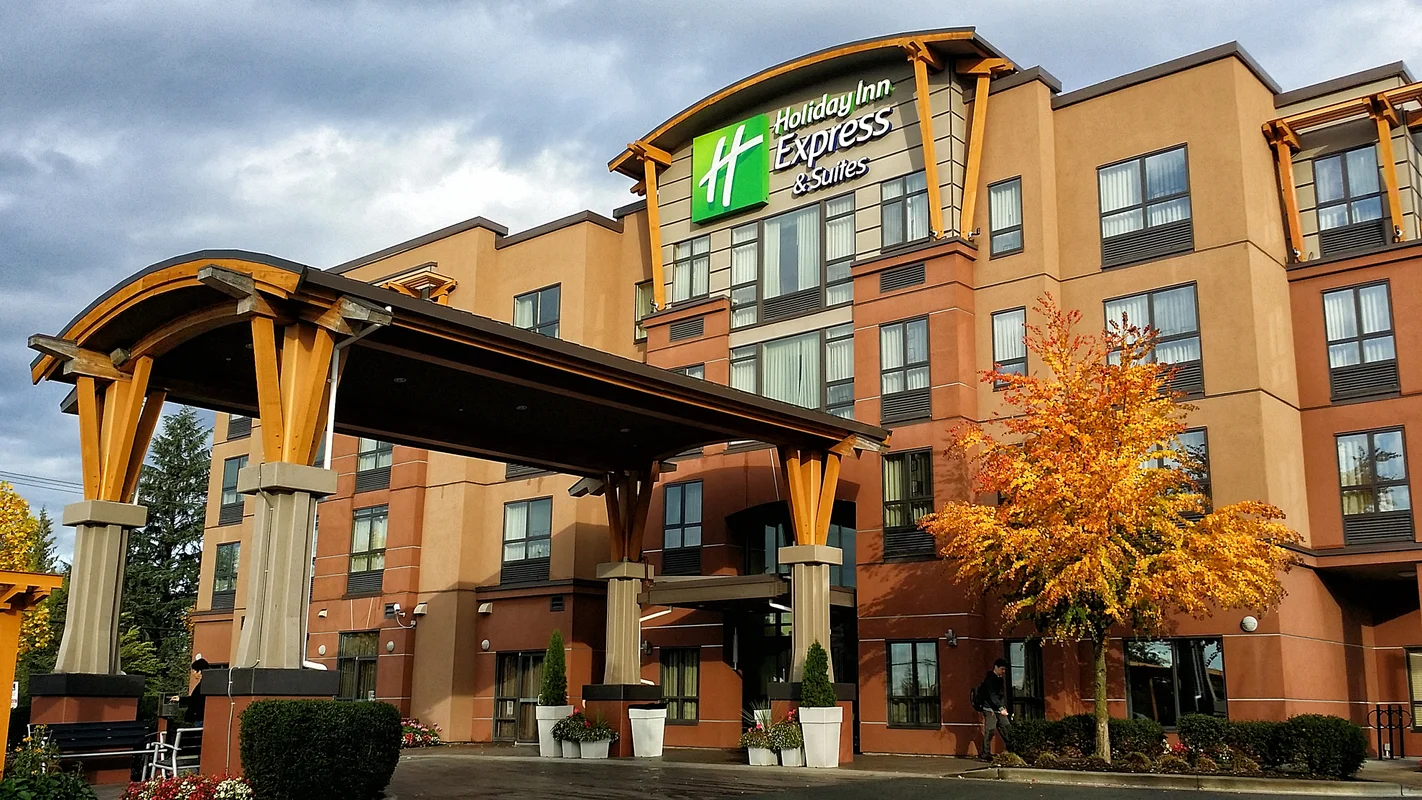 Commercial hotel exterior with glass entrance and windows