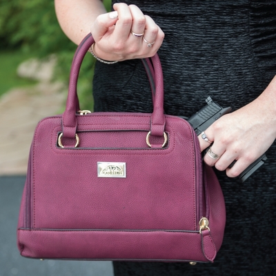 These handbags are quickly becoming a favorite for female gun owners because of the discrete zipper compartments located on both sides of the bag.